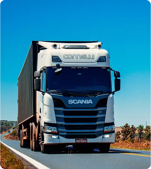 Rectangle 7 Camião branco a andar numa rua